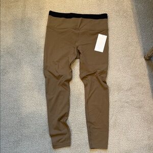 NWT Athleta ultra high rise elation double up tight tan/black leggings. Size L.